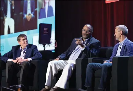  ?? COURTESY OF AUTM ?? Dr. Rodney Ridley Sr., center, provides his expertise on technology transfer alongside panelists Chuck Valauskas, Valauskas Corder, LLP, left, and Keith Marmer, University of Utah.