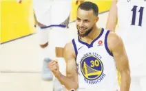  ?? Carlos Avila Gonzalez / The Chronicle ?? Stephen Curry is pumped after beating the halftime buzzer.