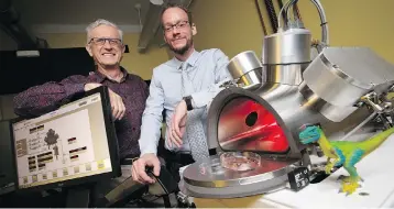  ?? PETER POWER / THE CANADIAN PRESS ?? Professors Maikel Rheinstadt­er, right, and Ralph Pudritz pose with the planet simulator at the origins of life lab at McMaster University in Hamilton, Ont. The researcher­s are using the lab to simulate and test Darwin’s “warm little ponds” theory of how life began on Earth.