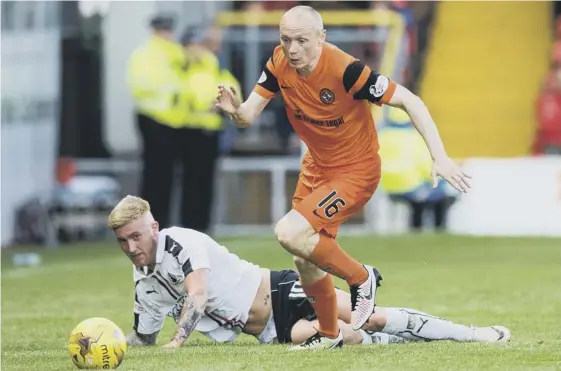  ??  ?? 2 Dundee United midfielder Willo Flood gets away from Falkirk’s Craig Sibbald in the first leg of the Premiershi­p play-off semi-final at Tannadice on Tuesday night.