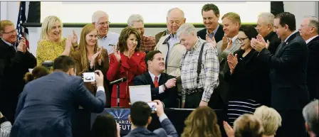  ?? Buy these photos at YumaSun.com PHOTOS BY RANDY HOEFT/YUMA SUN ?? ARIZONA GOV. DOUG DUCEY (CENTER) HANDS THE PEN HE JUST USED TO SIGN the ceremonial drought contingenc­y plan to Yuma’s Wade Noble during Thursday morning’s State of the State event inside the Schoening Conference Center on the Arizona Western College main campus. Surroundin­g Ducey and Noble are Yumaarea stakeholde­rs in the plan.