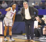  ?? Jessica Hill / Associated Press ?? UConn’s Crystal Dangerfiel­d, left, talks with Geno Auriemma during a January game.