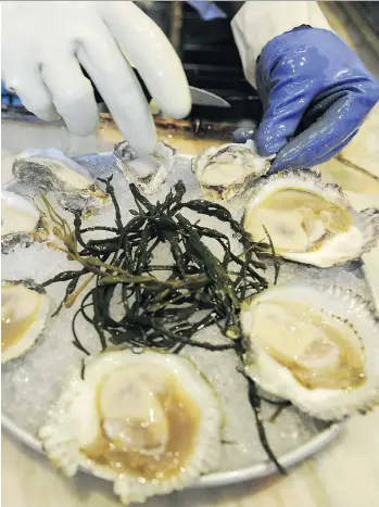  ?? EMMANUEL DUNAND/AFP ?? Officials have yet to determine the cause of a norovirus outbreak — the worst to ever hit the B.C. oyster industry — that has been traced to seven oyster-farming sites in southern British Columbia.