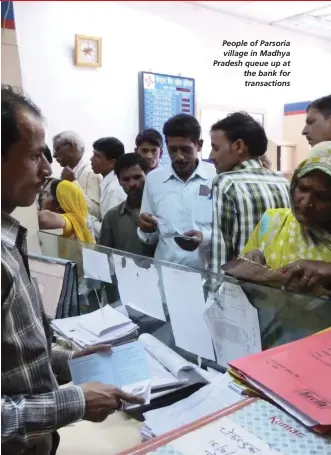 ??  ?? People of Parsoria village in Madhya Pradesh queue up at the bank for transactio­ns