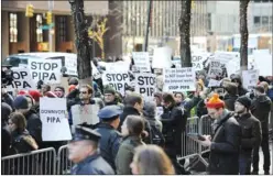  ?? STAN HONDA/AFP-GETTY IMAGES ?? People protest against the proposed laws to curb Internet piracy outside the offices of U.S. Democratic Senators Chuck Schumer and Kirsten Gillibrand in New York.