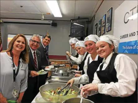  ?? PHOTO PROVIDED ?? WSWHE BOCES Culinary Arts students, at right, serve lunch to instructor Jane Amorosi, state Sen. James Tedisco andWSWHE BOCES District Superinten­dent James Dexter.