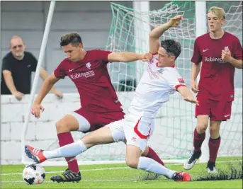  ?? Picture: Gary Browne FM4428196 ?? Canterbury beaten to the ball by a Whitstable sliding tackle