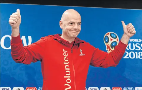  ??  ?? Fifa president Gianni Infantino greets the audience at a news conference at the Luzhniki Stadium in Moscow yesterday.