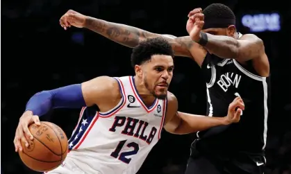  ?? ?? Philadelph­ia’s Tobias Harris dribbles against Brooklyn’s Royce O'Neale during the second half of Saturday’s game. Photograph: Sarah Stier/Getty Images
