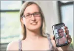  ?? Associated Press ?? Bailey Coffman shows her photo as a man in the Snapchat app during an interview in New York.