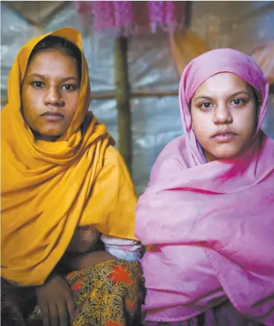  ??  ?? Rohingya refugees Nur Kalima, 18 (left), and Mubaraka Begum, 15.
The teenagers fled their homeland after being sexually assaulted by the Myanmar military and are now in a makeshift camp in Bangladesh.