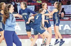  ?? IAN MAULE/TULSA WORLD ?? Edmond North’s Elle Paphronis, Grace Jackson, Mallory Jackson, and KK Peeler celebrate after beating Putnam West on Friday in Norman.