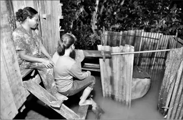  ??  ?? Nary (right), a Cambodian victim of forced marriage to a Chinese man, sitting with her mother on the steps of their family home in Phnom Penh. — AFP photos