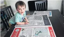  ?? PHOTO: NICOLA WILSON ?? Puzzling days . . . Lewis Wilson (2) loves doing the puzzle pages.