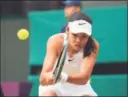  ?? Alberto Pezzali / Associated Press ?? Emma Raducanu plays a return to Sorana Cirstea during the third round at Wimbledon on Saturday.