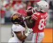  ?? JAY LAPRETE — ASSOCIATED PRESS ?? Ohio State’s Terry McLaurin catches a touchdown pass over Minnesota’s Coney Durr on Oct. 13 in Columbus.