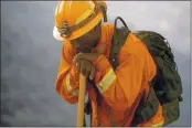  ??  ?? An inmate firefighte­r rests during a break from battling the River Fire in Salinas.