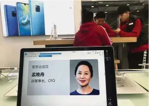  ??  ?? In custody: A profile of Meng is displayed on a computer at a Huawei store in Beijing. The Chinese government, speaking through its embassy in Canada, strenuousl­y objected to the arrest, and demanded Meng’s immediate release. — AP