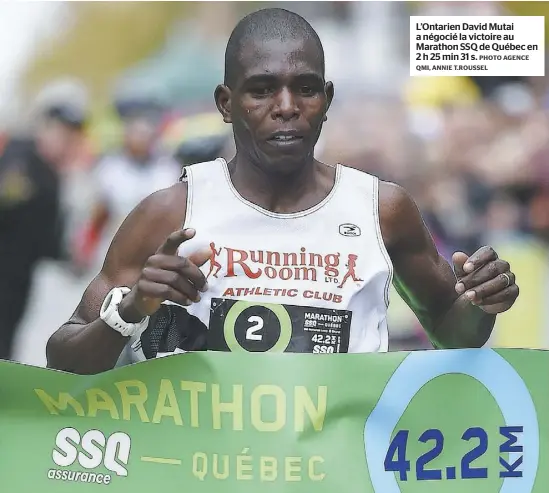  ?? PHOTO AGENCE QMI, ANNIE T.ROUSSEL ?? L’Ontarien David Mutai a négocié la victoire au Marathon SSQ de Québec en 2h25min31s.