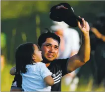  ?? KEVIN C. COX/GETTY IMAGES ?? An emotional Jason Day holds son Dash after winning the PGA Championsh­ip. Day finished 20 under par, a record for a major.