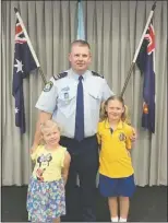  ??  ?? Detective Senior Constable Damien Knowles with Indi and Maya