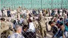 ??  ?? Soldiers tried to maintain some degree of order as thousands gathered at Kabul's airport