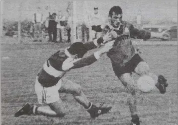  ??  ?? Bray’s John Walsh tries to block John Traynor during the first game in Ashford.