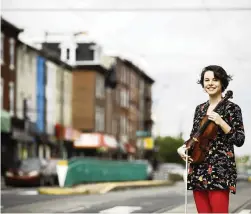  ?? MATT ROURKE AP ?? Violist Brooke Mead, shown May 1 in Philadelph­ia, was invited to perform her graduation recital on the Philadelph­ia Orchestra’s live webcast.