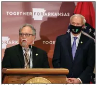  ??  ?? Interim Health Secretary Jose Romero and Gov. Asa Hutchinson discuss testing during Thursday’s daily briefing. Hutchinson says the state “is doing well in testing,” and he and Romero say testing is being expanded.
(Arkansas Democrat-Gazette/Thomas Metthe)