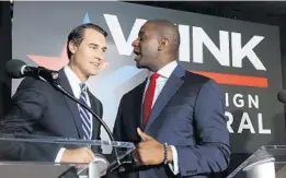  ?? WILFREDO LEE/ASSOCIATED PRESS ?? Winter Park businessma­n Chris King, left, and Tallahasse­e Mayor Andrew Gillum were formerly opponents in the gubernator­ial race but are now running mates.