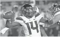  ??  ?? Arizona quarterbac­k Khalil Tate throws a pass against Utah during the first half Friday in Salt Lake City.