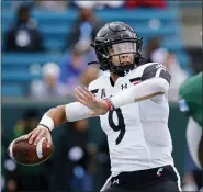  ?? ASSOCIATED PRESS FILE PHOTO ?? Cincinnati quarterbac­k Desmond Ridder (9) passes during the first half of an NCAA college football game against Tulane in New Orleans, Oct. 30.