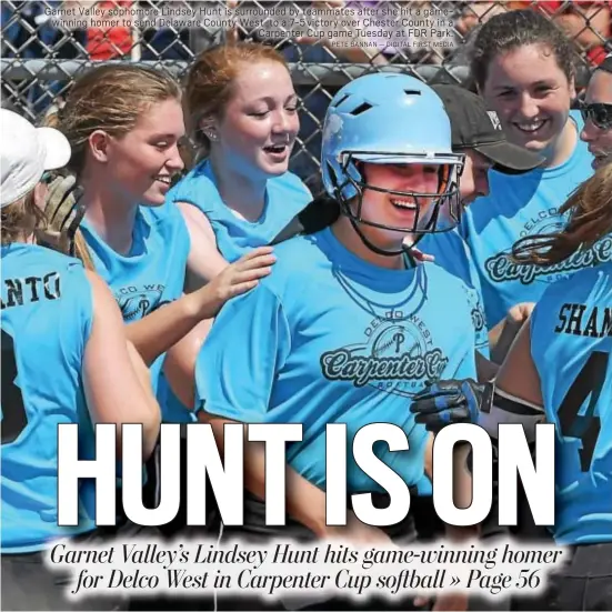  ?? PETE BANNAN — DIGITAL FIRST MEDIA ?? Garnet Valley sophomore Lindsey Hunt is surrounded by teammates after she hit a gamewinnin­g homer to send Delaware County West to a 7-5 victory over Chester County in a Carpenter Cup game Tuesday at FDR Park.