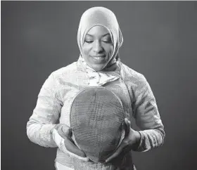  ?? JAE C. HONG/ASSOCIATED PRESS ?? Ibtihaj Muhammad says fencing called to her as “a sport where I could be fully covered and I didn’t have to look different.” She will compete in saber in Rio de Janeiro.