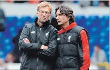  ?? ASSOCIATED PRESS FILE PHOTO ?? Liverpool manager Juergen Klopp, left, talks with assistant manager Zeljko Buvac in 2015. Buvac is spending some time away from the team.