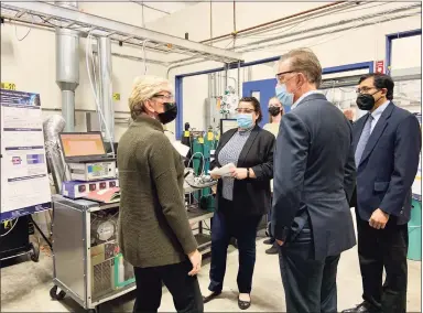  ?? Ginny Monk / Hearst Connecticu­t Media ?? U.S. Secretary of Energy Jennifer M. Granholm and Gov. Ned Lamont take a tour of Precision Combustion in North Haven on Thursday.