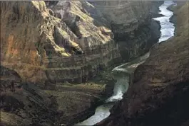  ?? Luis Sinco Los Angeles Times ?? THE COLORADO RIVER, which supplies water to seven U.S. states and northern Mexico, f lows through the Grand Canyon in Arizona.