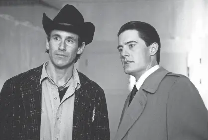  ?? ABC VIA GETTY IMAGES ?? Michael Ontkean as Sheriff Harry Truman and Kyle MacLachlan as Special Agent Dale Cooper investigat­e the murder of Laura Palmer in Twin Peaks.