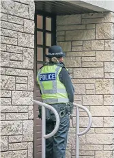  ?? Picture: Kris Miller. ?? A police officer at the property in Elie last night.