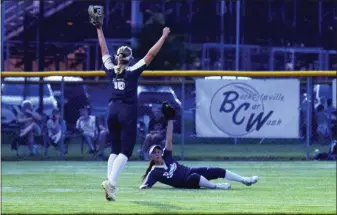  ?? AUSTIN HERTZOG - MEDIANEWS GROUP ?? Spring-Ford left fielder Ali Wescott, ground, shows her glove after making the game-ending diving catch as shortstop Riley Gancasz begins the celebratio­n after defeating North Penn 2-0in a PIAA Class 6A semifinal Monday at Boyertown.