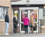  ??  ?? Patients queue outside Scoonie Medical Practice in Leven.