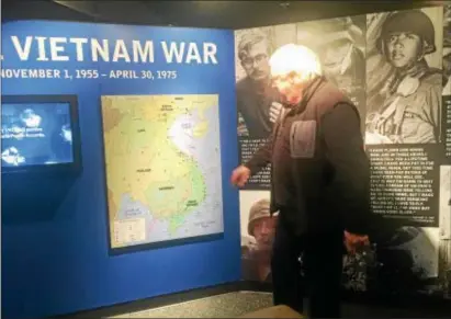  ?? PEG DEGRASSA – DIGITAL FIRST MEDIA ?? Vietnam War Exhibit creator Ed Buffman Jr., points out places on the map that had meaningful significan­ce in the Vietnam War.