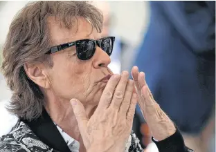  ?? CREDIT ?? Mick Jagger blows a kiss as he arrives ahead of a news conference at the 76th Venice Film Festival in Venice, Italy, Saturday.
