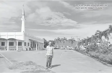  ??  ?? Lee at the car park located between the church and the mosque in Lutong.