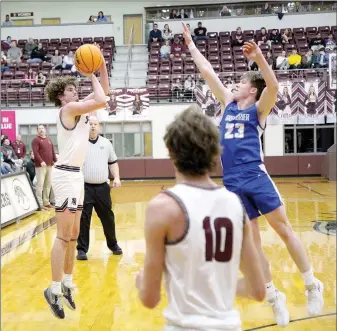  ?? Mark Ross/Special to the Herald-Leader ?? Siloam Springs senior Nate Vachon shoots a 3-pointer over the outstretch­ed hand of Greenbrier’s Jack Runsick as Levi Fox watches during Friday’s game at Panther Activity Center.