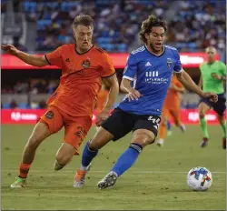  ?? NHAT V. MEYER — STAFF ARCHIVES ?? San Jose Earthquake­s forward Cade Cowell, who's generated interest from top European clubs, controls the ball against Houston Dynamo FC's Griffin Dorsey during a game last season at PayPal Park in San Jose.