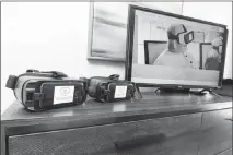  ?? WADE VANDERVORT ?? Rendever Virtual reality headsets, designed to help seniors recall healthy memories and experience new ones, are displayed April 5 during a Cox Smart Home tour in North Las Vegas.