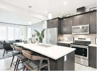  ?? DUSTIN HOFFERT/DCPIX PHOTOGRAPH­Y ?? The kitchen in the Destiny show home by Jayman Built in Belmont. Jayman, founded in 1980 by Jay Westman and his late father Al, is active in 16 communitie­s in the Calgary area.
