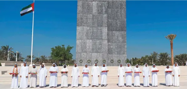  ?? WAM ?? Shaikh Mohammad Bin Rashid, Shaikh Mohammad Bin Zayed, Their Highnesses the Supreme Council Members and Rulers of the Emirates honour family members of the martyrs during the Commemorat­ion Day observance at Wahat Al Karama in Abu Dhabi yesterday.