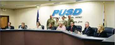  ?? PHOTOS COURTESY OF PUSD ?? Brig. Gen. James Gabrielli, director of the California Military Department's Youth and Community Programs, center, with cadets and the PUSD governing board after his announceme­nt that Governor Brown allotted $2.4 million of the state's 2018-19 budget...